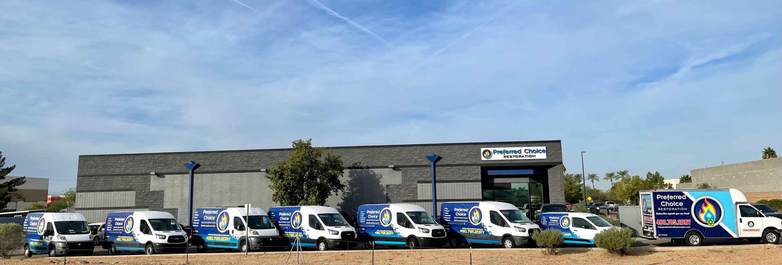 Preferred Choice Restoration service vans outside the Gilbert facility.