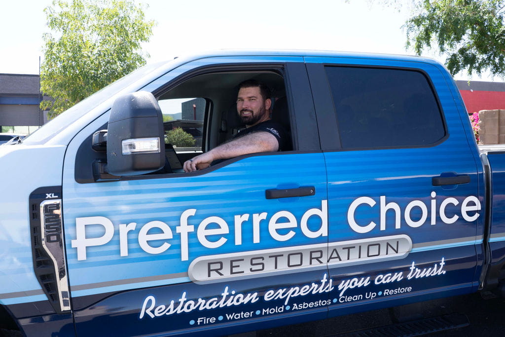 Preferred Choice project manager in a branded company truck