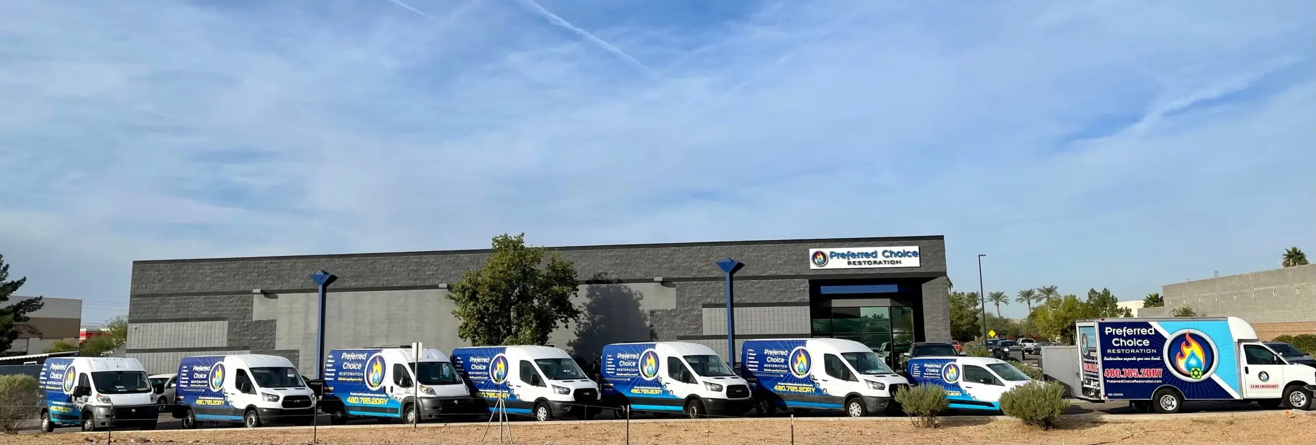 Preferred Choice Restoration service vans outside the Gilbert facility.